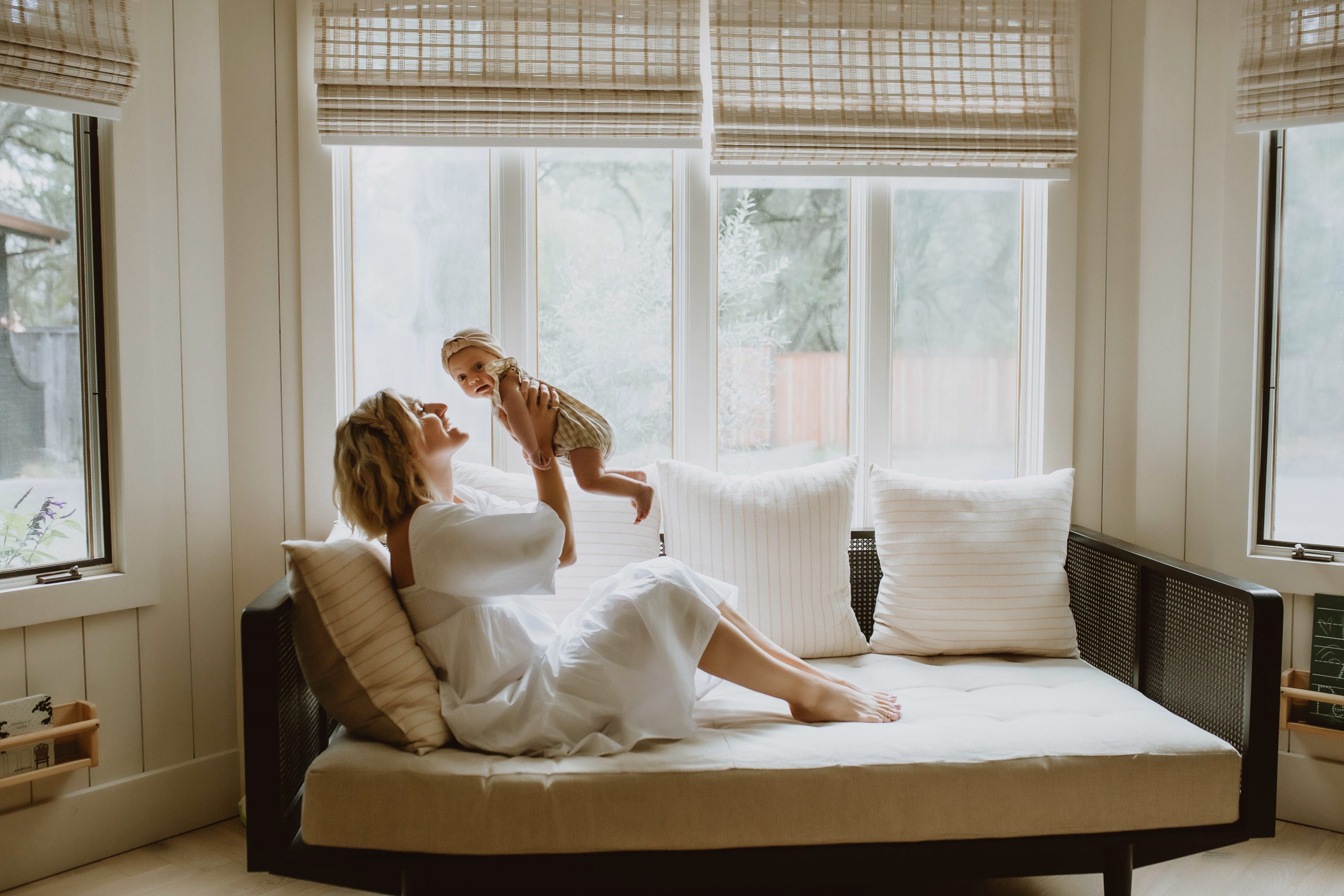 mother-with-baby-on-chaise-jillian-goulding-photography